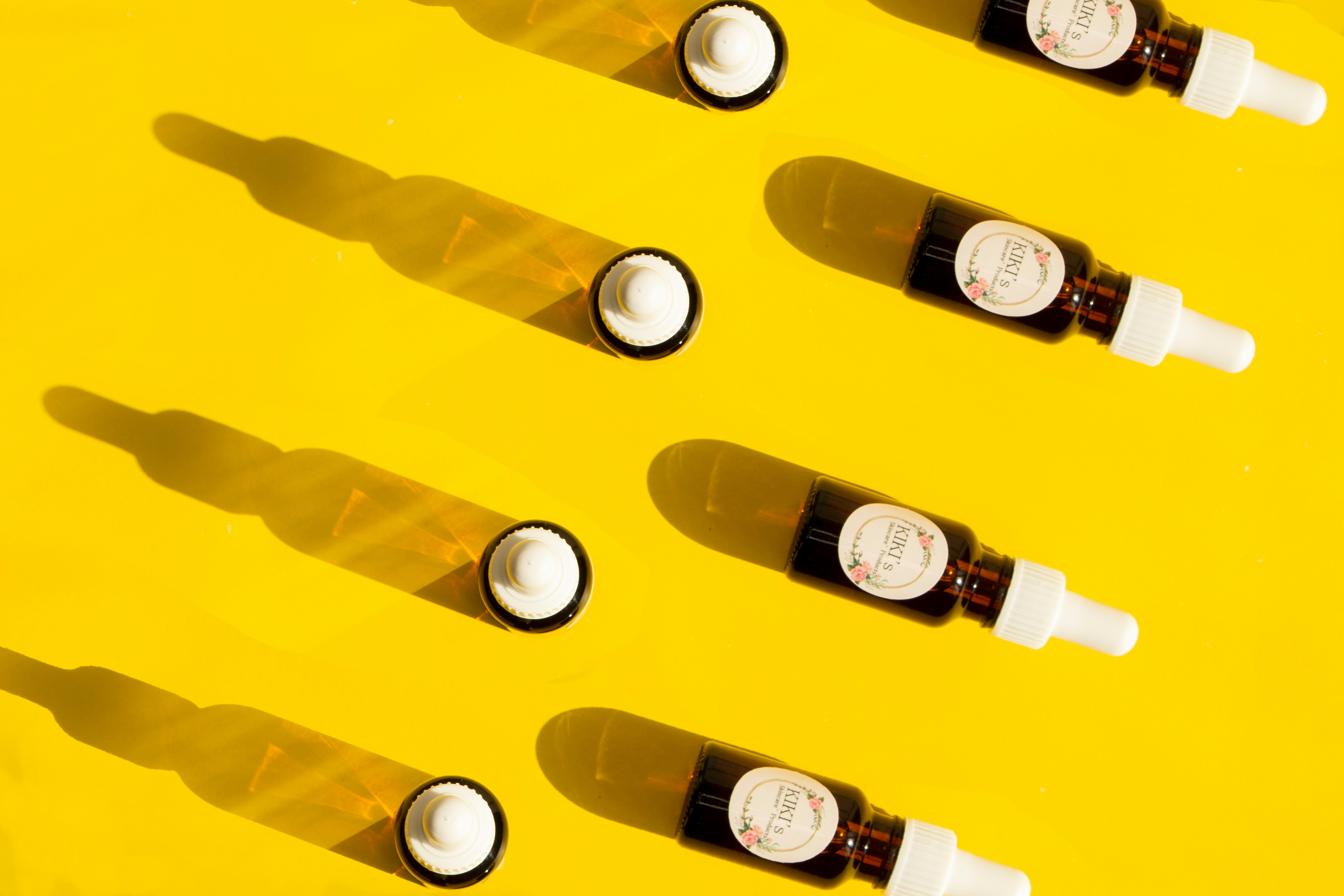 white labeled bottles on yellow plastic container